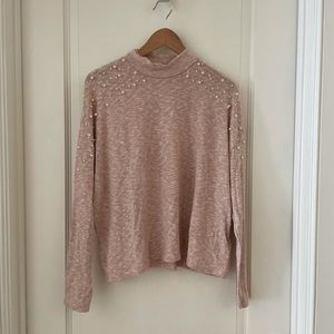 Pink mock neck sweater with pearl details